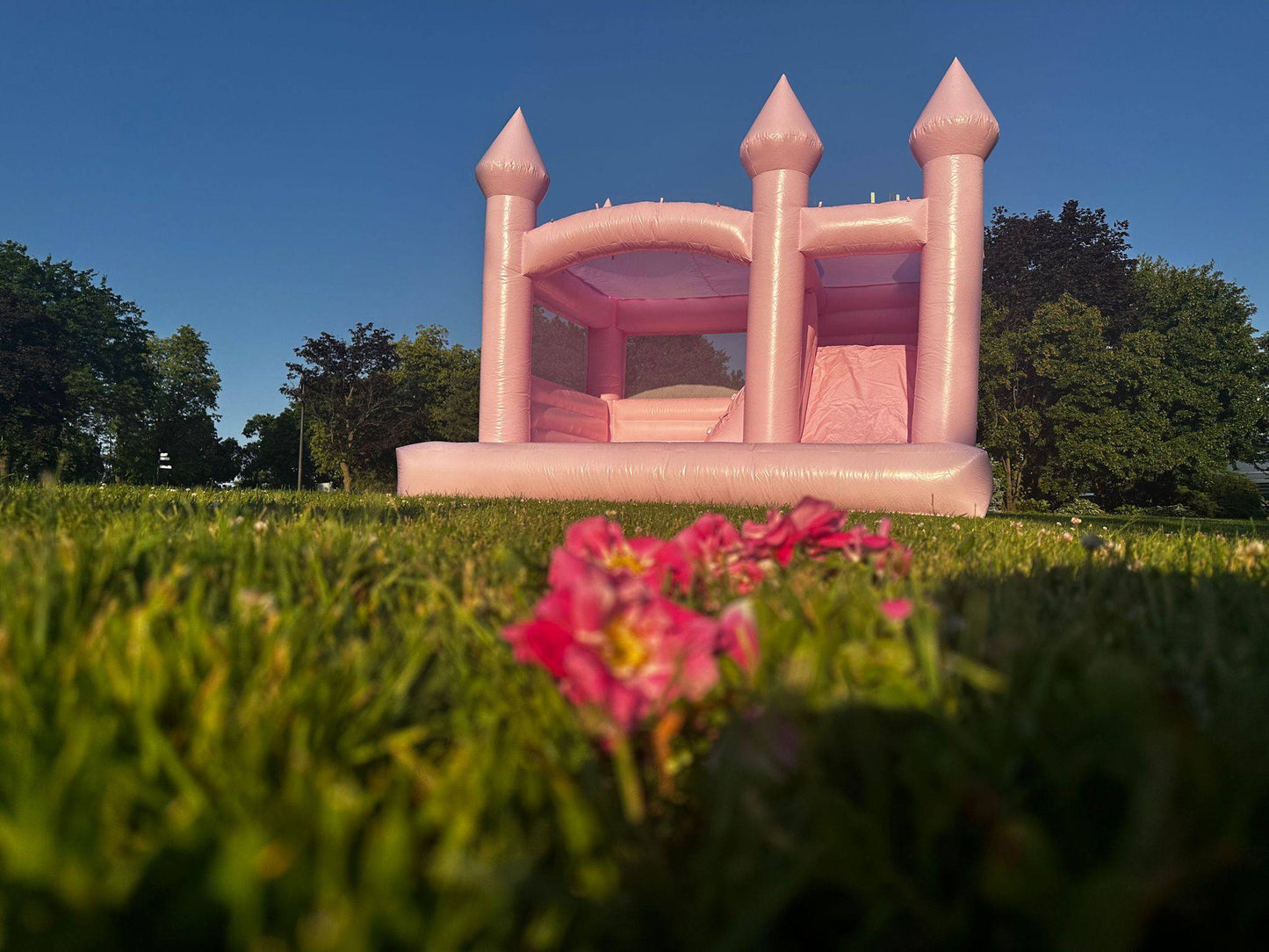 Large pink castle toy by My Store with tall towers and colorful flags, perfect for kids' imaginative play.