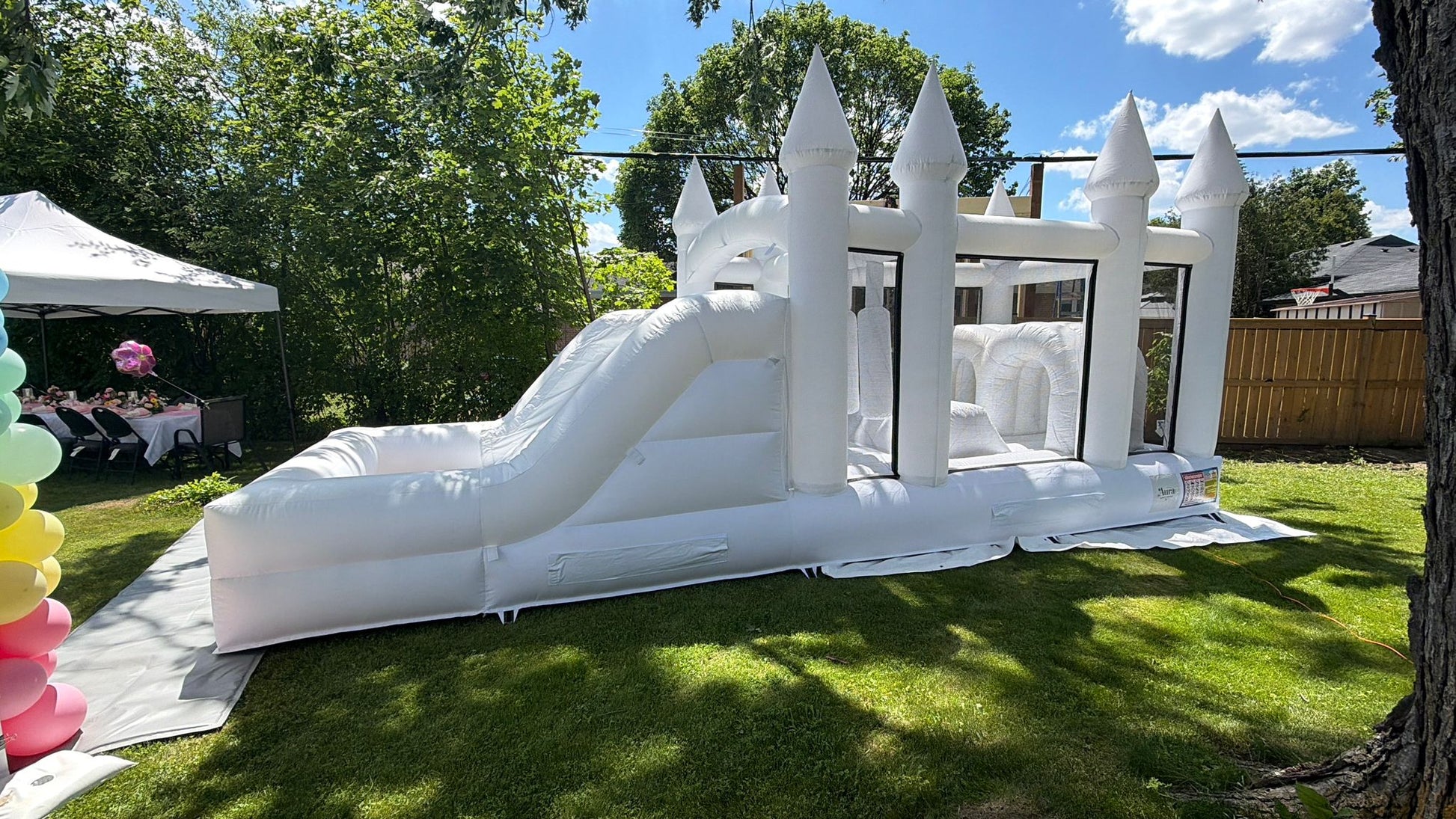 Colorful obstacle course with ball pit and waterslide from Aura Luxury Rental Ltd, featuring vibrant slides, climbing areas, and play zones.